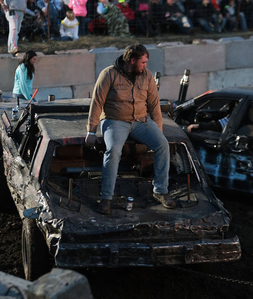 Austin Schaefer sits on top of his demolition car